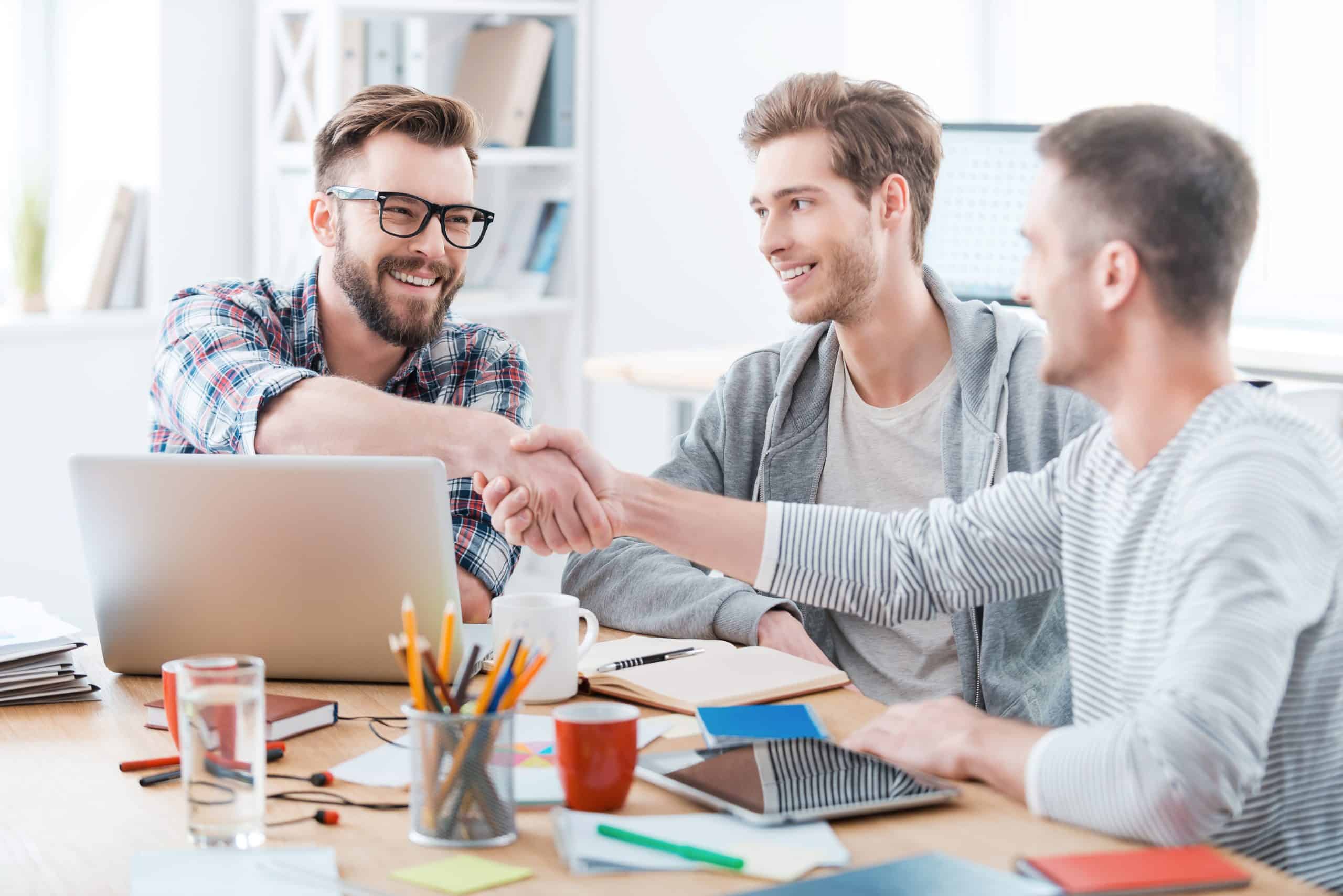 group meeting and shaking hands